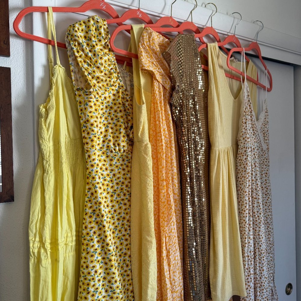 Seven yellow dresses
